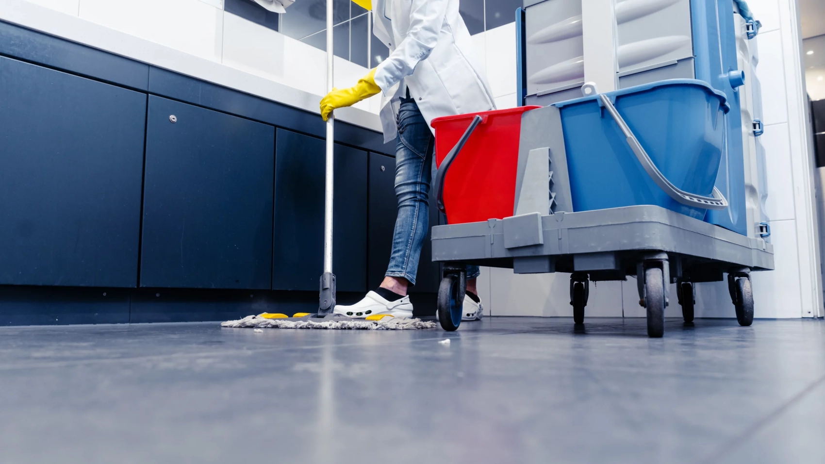 low-section-man-cleaning-floor-public-restroom