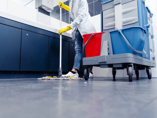 low-section-man-cleaning-floor-public-restroom