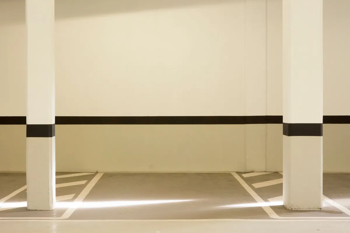 Empty indoor parking spaces in a covered garage